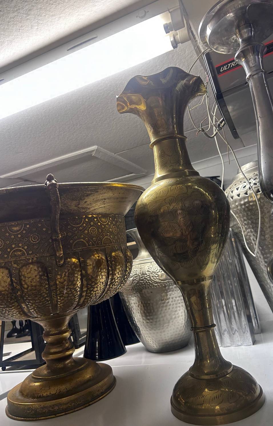 Variety of gold metal vases 